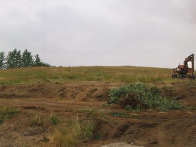 To generationer af maskiner i gang med at lave parkeringsplads